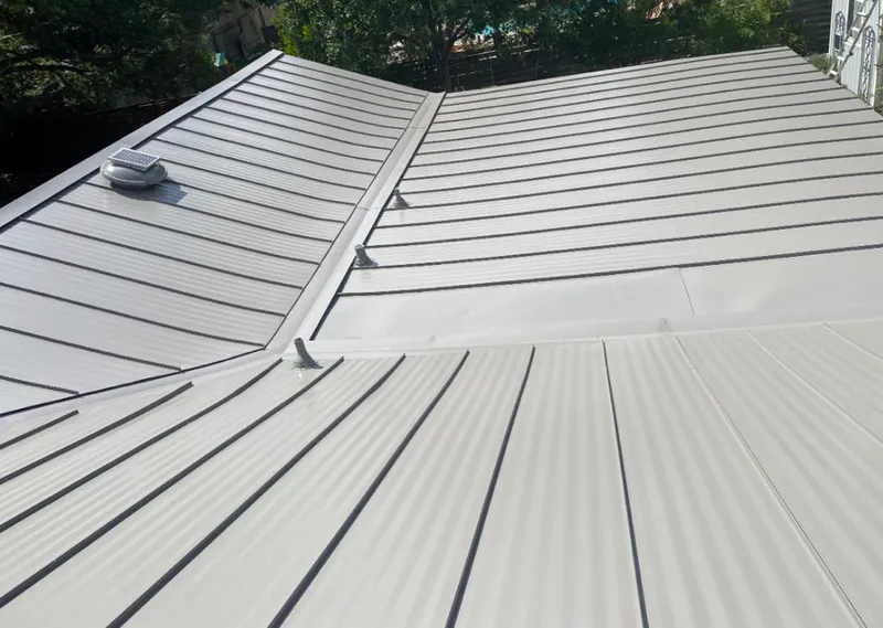 Solar attic fan installed on a metal roof for Roof Ventilation in Cutler Bay